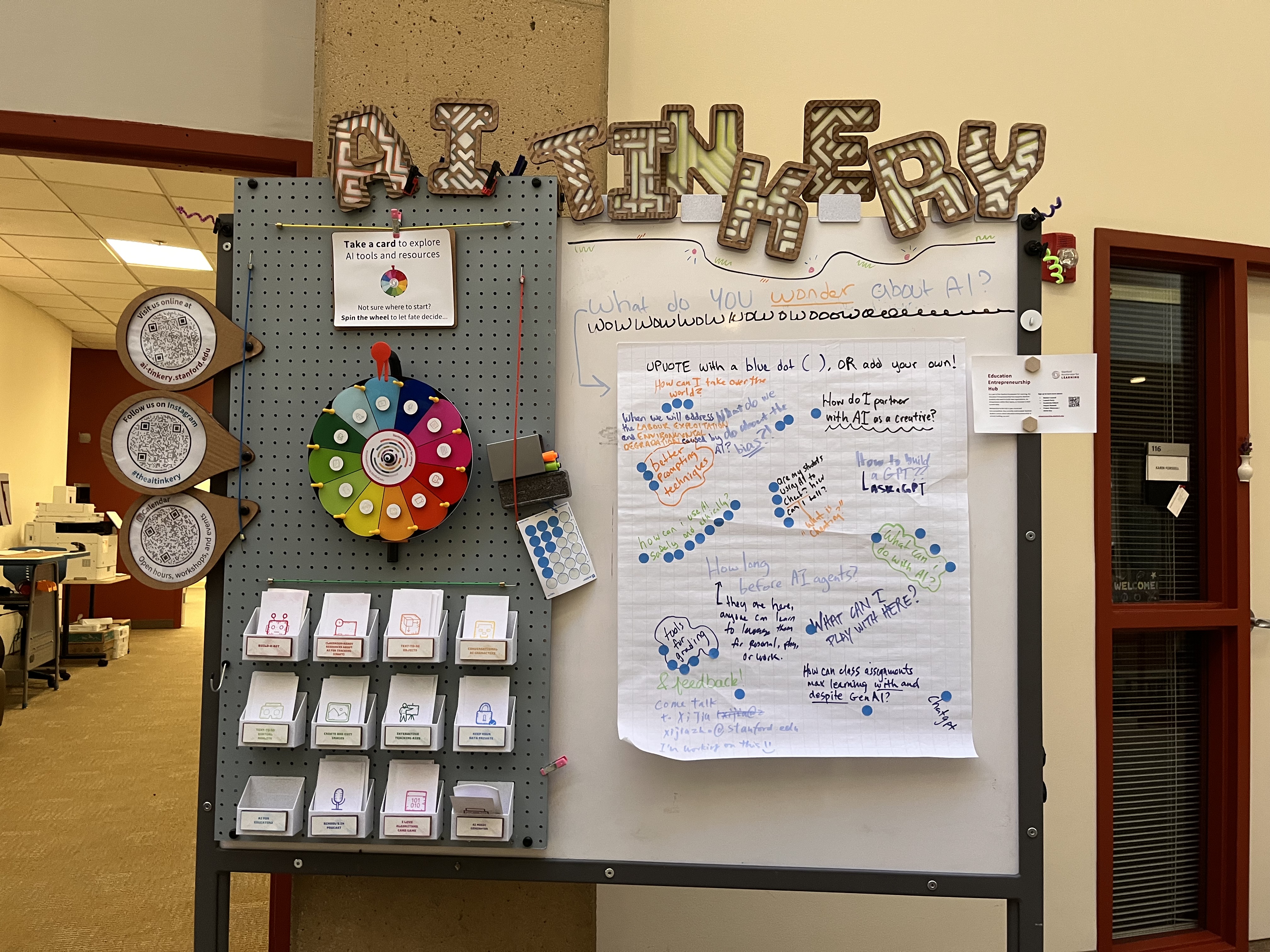 image of sign outside AI Tinkery at Stanford University showing take-aways and projects that people can experience in the space
